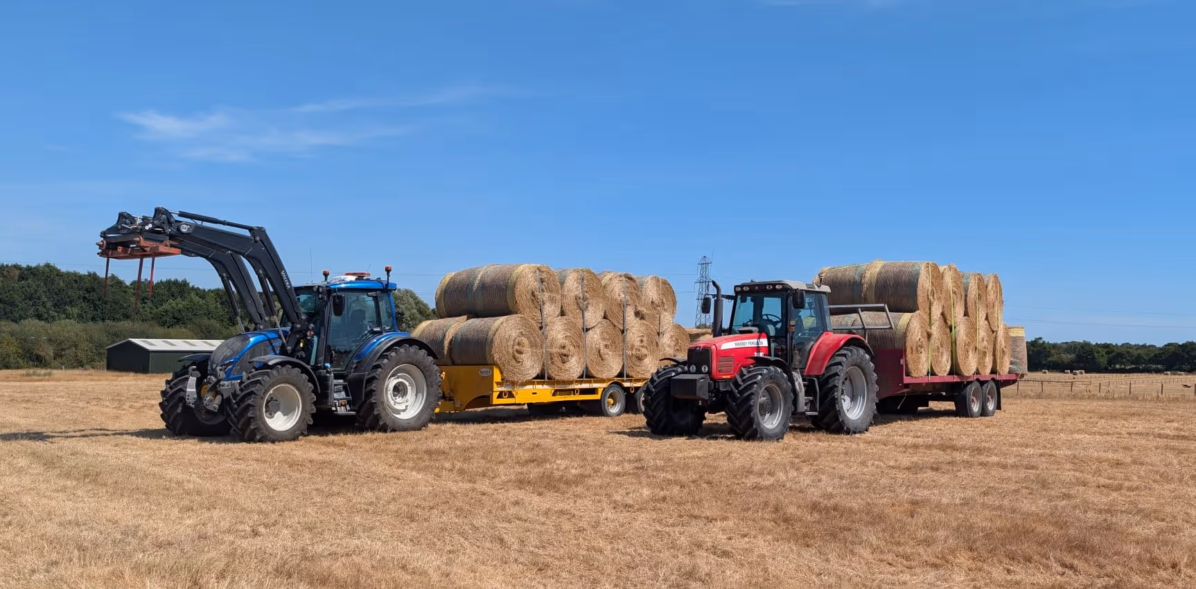 hartcliff farm tractors hauling round hay bales